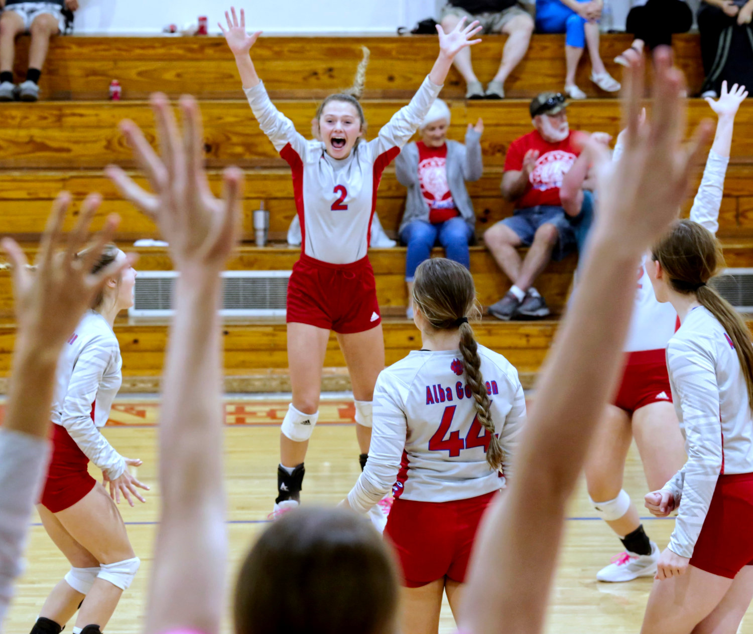 Victory is sweet – the Lady Panthers react to the match-winning point against Boles.
